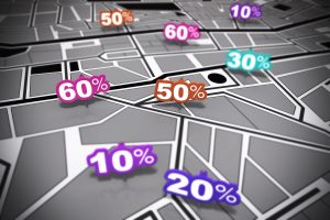 many percent signs over a grey city map with focus effect each number is pointing onto a different location